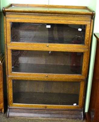 Lot 1255 - Three tier oak bookcase in the manner of Globe Wernicke