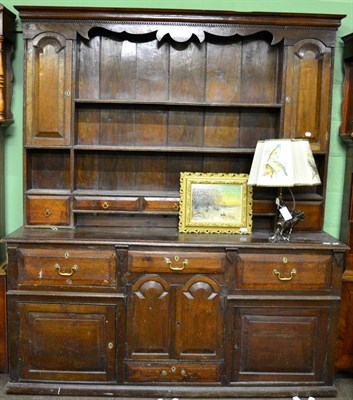 Lot 1257 - Oak dresser and rack, fitted with an arrangement of cupboards and shelves