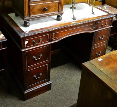 Lot 1263 - Mahogany twin-pedestal desk, top with carved gadrooned border