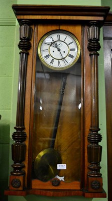 Lot 1267 - A Vienna type walnut veneered striking wall clock, with two brass weights