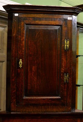 Lot 1270 - An oak corner cupboard