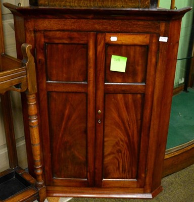 Lot 1271 - Mahogany wall hanging corner cupboard with shelved interior