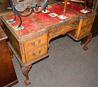 Lot 1278 - A burr walnut desk, on cabriole supports