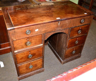 Lot 1281 - George III mahogany kneehole desk with hinged top