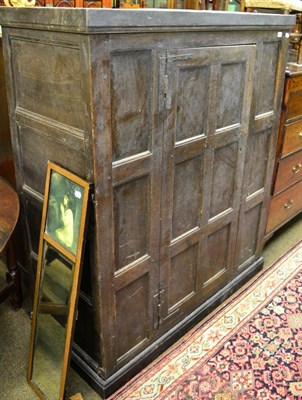 Lot 1284 - Panelled oak cupboard with single door