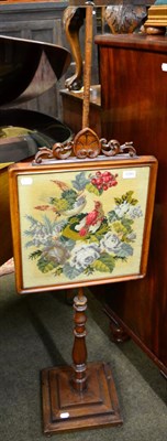 Lot 1293 - A 19th century mahogany pole screen, with tapestry panel