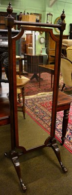 Lot 1295 - A 19th century mahogany and barber's pole strung cheval mirror, with shaped rectangular plate...