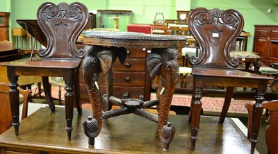 Lot 1304 - A pair of Victorian mahogany hall chairs, mid 19th century, with scrolled back supports centred...