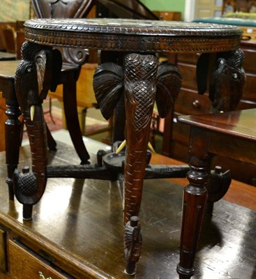 Lot 1305 - Indian table with elephant carved supports, circa 1930