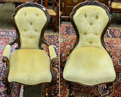 Lot 1309 - A pair of Victorian walnut framed button back 'his' and 'hers' chairs, cabriole legs, porcelain...