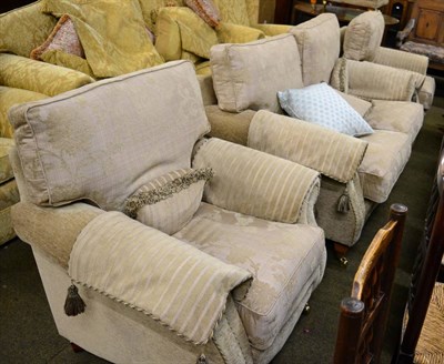 Lot 1316 - A modern three piece suite comprising a two seater sofa and two chairs together with a matching...