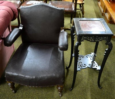 Lot 1322 - A Chinese plant stand and a leatherette armchair