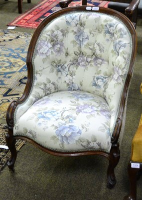 Lot 1325 - Victorian mahogany nursing chairs upholstered in later floral fabric