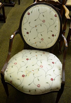 Lot 1330 - Mahogany open armchair, oval backrest and serpentine fronted seat on reeded tapering supports