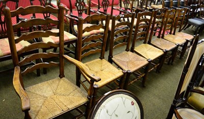 Lot 1331 - Seven rush seated ladder back chairs