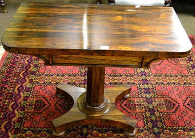 Lot 1342 - A 19th century rosewood fold-over tea table