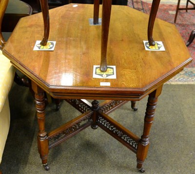 Lot 1343 - A Victorian mahogany plant table with pierced X-form stretcher