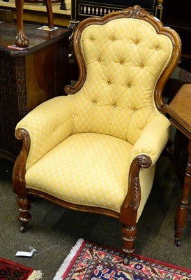 Lot 1345 - Victorian upholstered armchair on turned supports, with button back