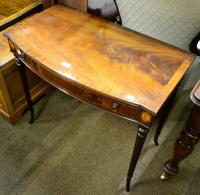 Lot 1350 - Reproduction mahogany side table, the single drawer with lion mark drop-ring handles, on fluted...