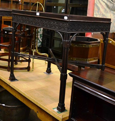 Lot 1356 - A George III style mahogany silver table, with a blind fret carved frieze, raised on cluster column