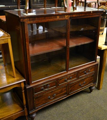 Lot 1359 - A mid-19th century mahogany glazed cabinet, with two double doors enclosing an adjustable...