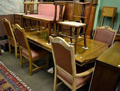 Lot 1366 - A 20th century oak extending dining table and six chairs (4+2) (7)