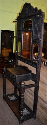 Lot 1369 - Late Victorian carved oak mirror back hall stand