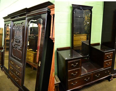 Lot 1375 - Large three section wardrobe with elaborately carved central, flanked by a pair of mirrored...