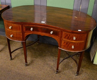 Lot 1382 - A kidney shaped Edwardian mahogany desk