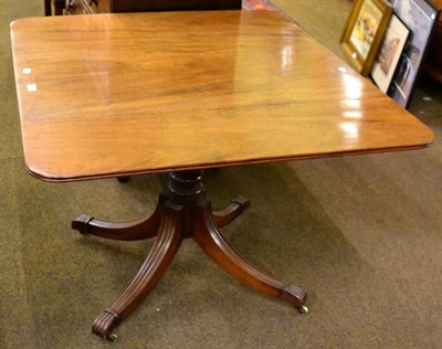 Lot 1384 - A George IV mahogany sofa table, 2nd quarter 19th century, with two rounded drop leaves above...