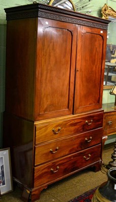 Lot 1389 - A 19th century mahogany press cupboard