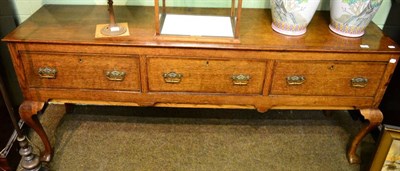 Lot 1390 - Oak sideboard fitted with three drawers on cabriole supports