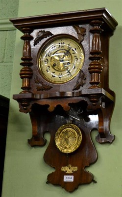 Lot 1394 - An Art Nouveau striking walnut veneered wall clock