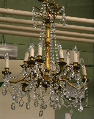 Lot 1398 - Gilt metal and cut glass twelve-light chandelier