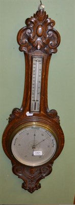 Lot 1401 - An oak aneroid barometer