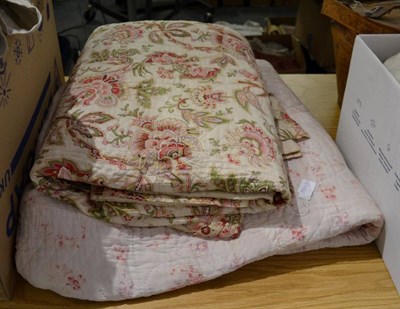 Lot 1441 - Light pink quilt, printed with a design of darker pink roses, the reverse in baby pink cotton,...