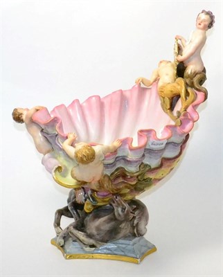 Lot 6 - A large Capodimonte centrepiece in the form of a merman and sea horses surrounding a shell, holding