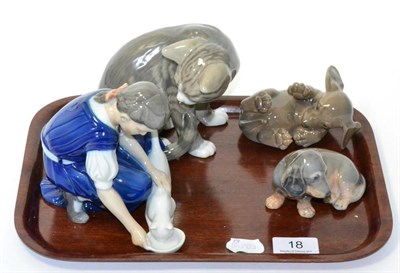 Lot 18 - Four Royal Copenhagen figures comprising of a cat, a girl with cat and two puppies