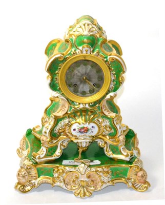 Lot 22 - A green porcelain and floral decorated striking mantel clock, raised upon a matching porcelain...