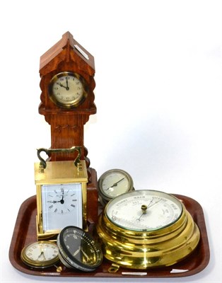Lot 25 - A miniature oak cased longcase clock, a brass carriage timepiece, barometer, and three other...