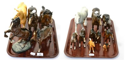 Lot 26 - A group of Beswick and other pottery horses including grey shire, palomino foal, etc (two trays)