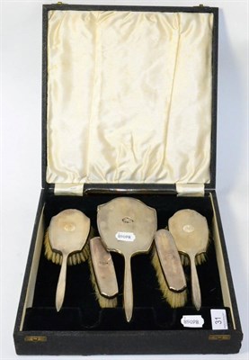 Lot 31 - A cased silver mounted dressing table set