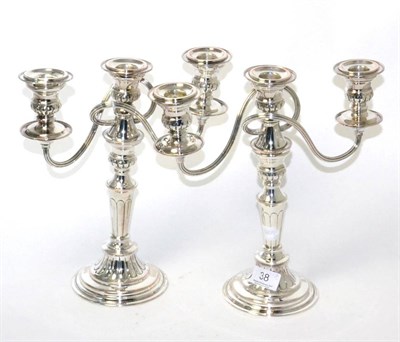 Lot 38 - A pair of plated three branch candelabra