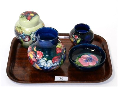 Lot 39 - Four pieces of Walter Moorcroft pottery, Spring flowers ginger jar and cover, two vases in the same