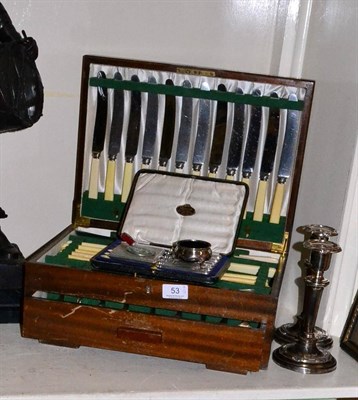 Lot 53 - Silver handled knives, silver cigarette case, pair of candlesticks and a canteen of plated cutlery
