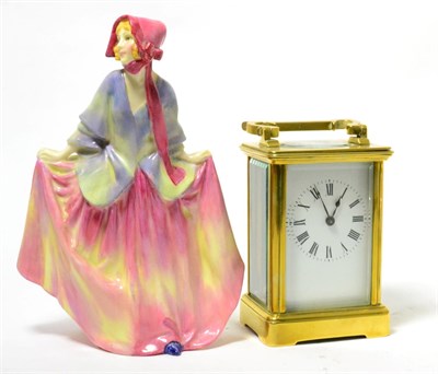 Lot 84 - A brass carriage timepiece and a Royal Doulton china figure 'Sweet Anne' HN1331