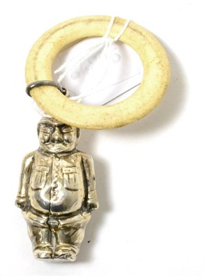 Lot 99 - A teething ring with silver policeman