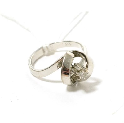 Lot 115 - A diamond solitaire ring with twist shoulders, 0.10 carat approximately, finger size N