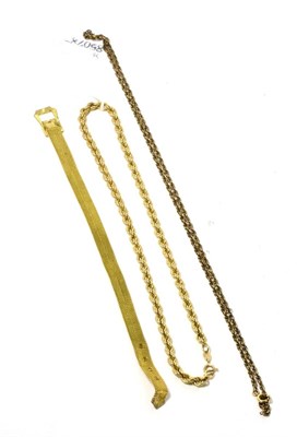 Lot 117 - A 9ct gold rope chain necklace, a Prince of Wales chain and a gilt metal buckle pattern mesh...
