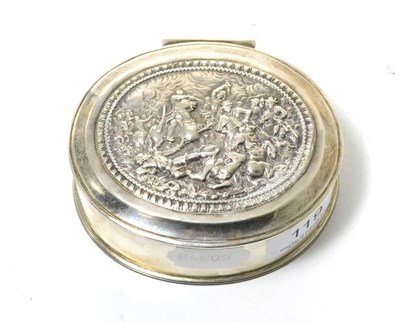 Lot 119 - A silver hinged box with gilt interior, the cover decorated with a battle scene